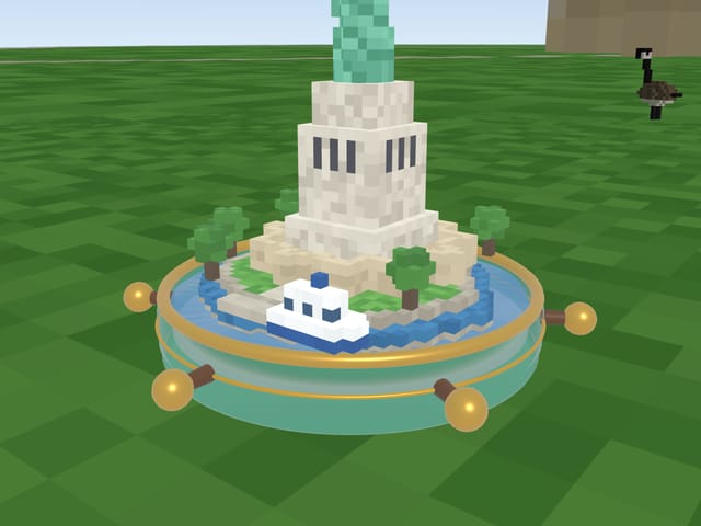 Liberty Island: the Statue of Liberty on its pedestal with a ferry in the harbour